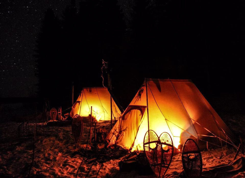 Winter camping using traditional survival techniques is a popular activity at North Woods Ways, C...