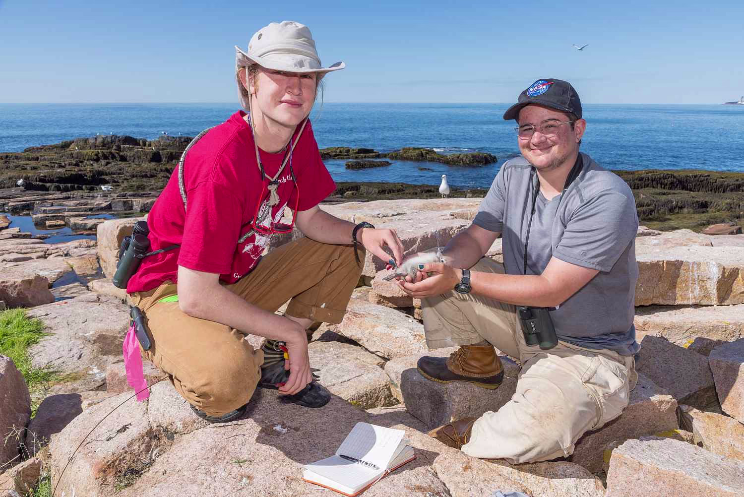 Watson Fellowship awardee Wriley Hodge ’24, left, banding birds at the COA Alice Eno Field Resear...