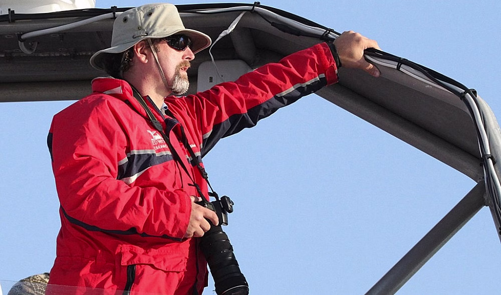Person in red jacket on boat