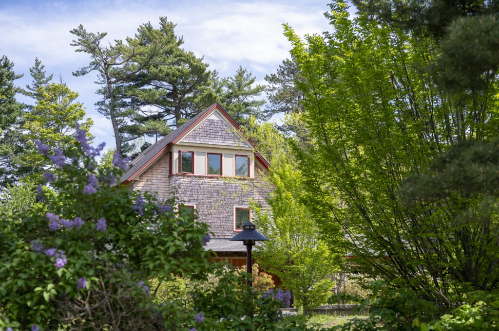 A Katherine W. Davis village house through trees