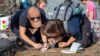 Students conducting field research outdoors.