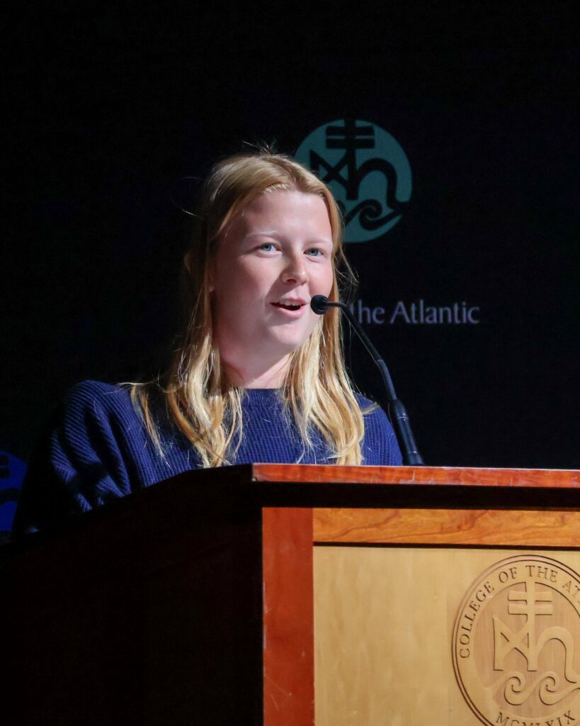 Young woman speaking at podium