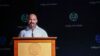 Man speaking at podium event